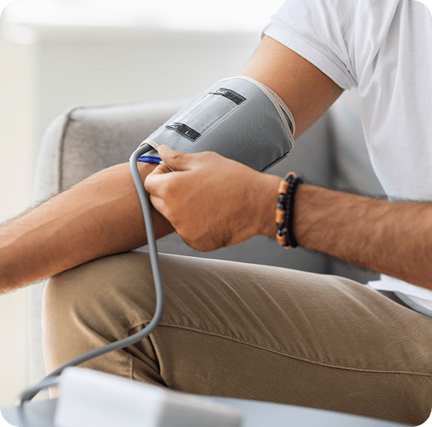 A man checking his blood pressure. - PrimeGENIX Calmlean.