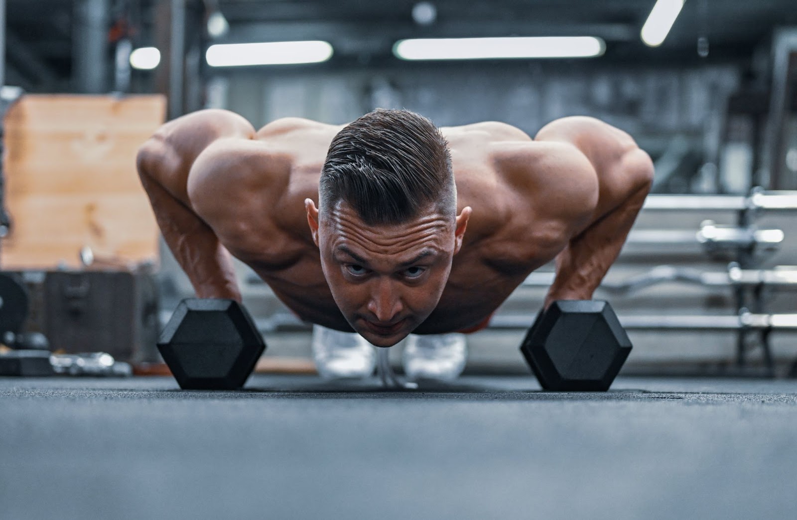 A man exercising with dumbbells